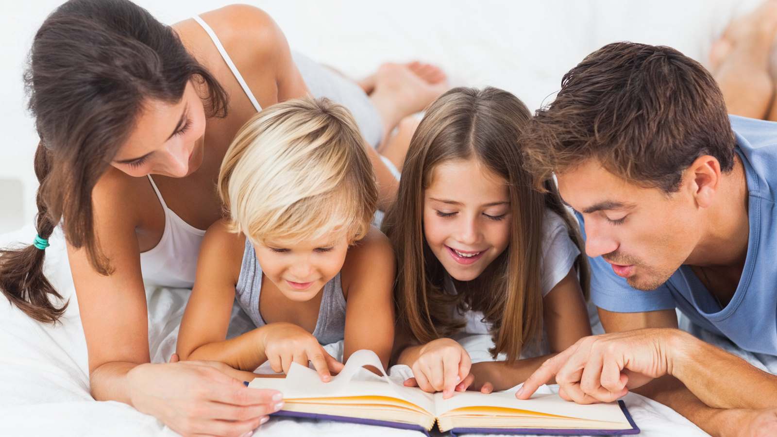 Woman reading Aye Write brochure in library