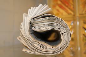 Image of rolled up newspapers